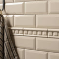 County white metro bevelled tile cream-colored ceramic rectangular tiles with glossy finish in subway pattern with decorative border