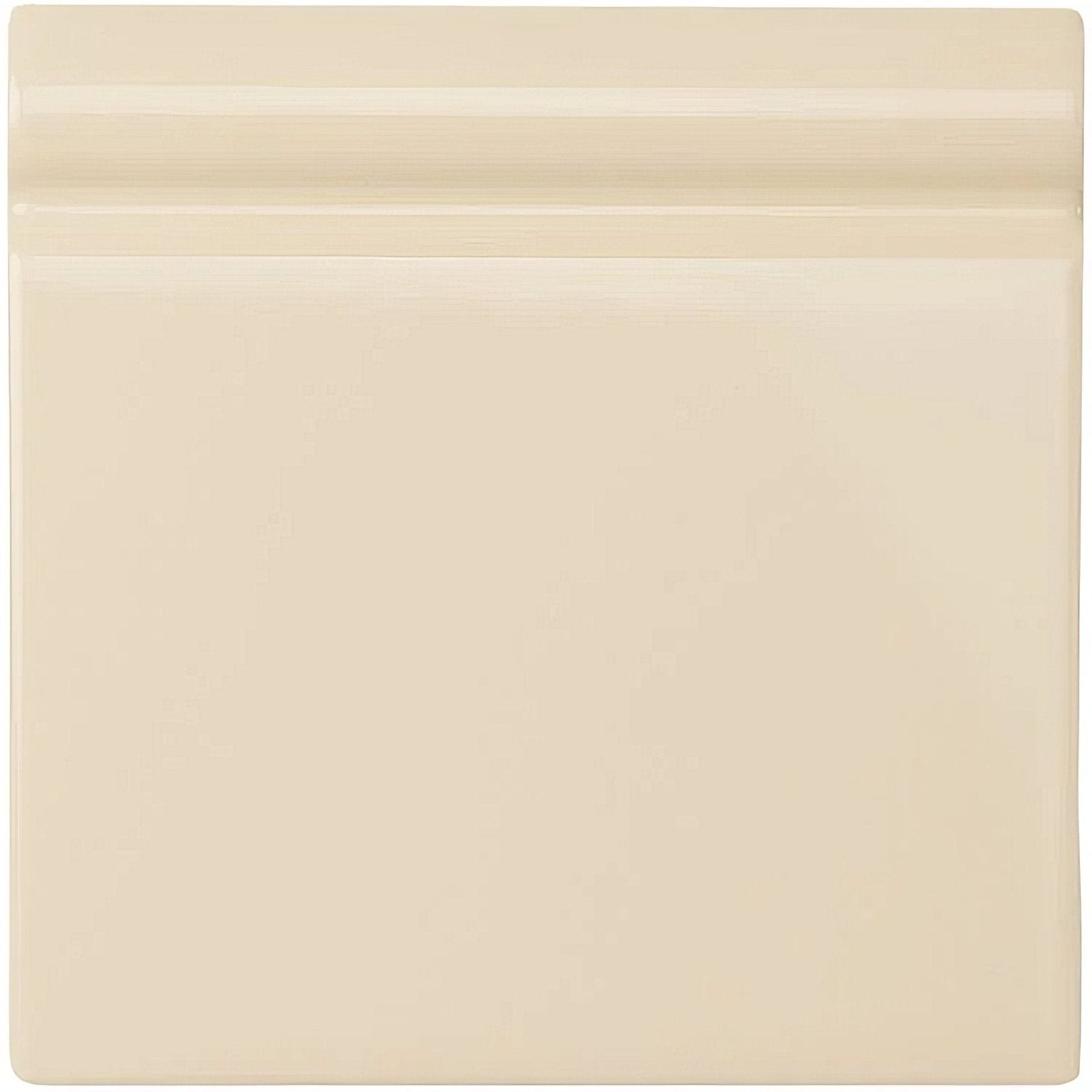 County white skirting tile in cream color with glossy ceramic finish and subtle horizontal ridge on top edge