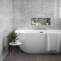 Creswell Grey Stone & Metal Mix Brick Mosaic grey and white marble brick mosaic with a white freestanding bathtub
