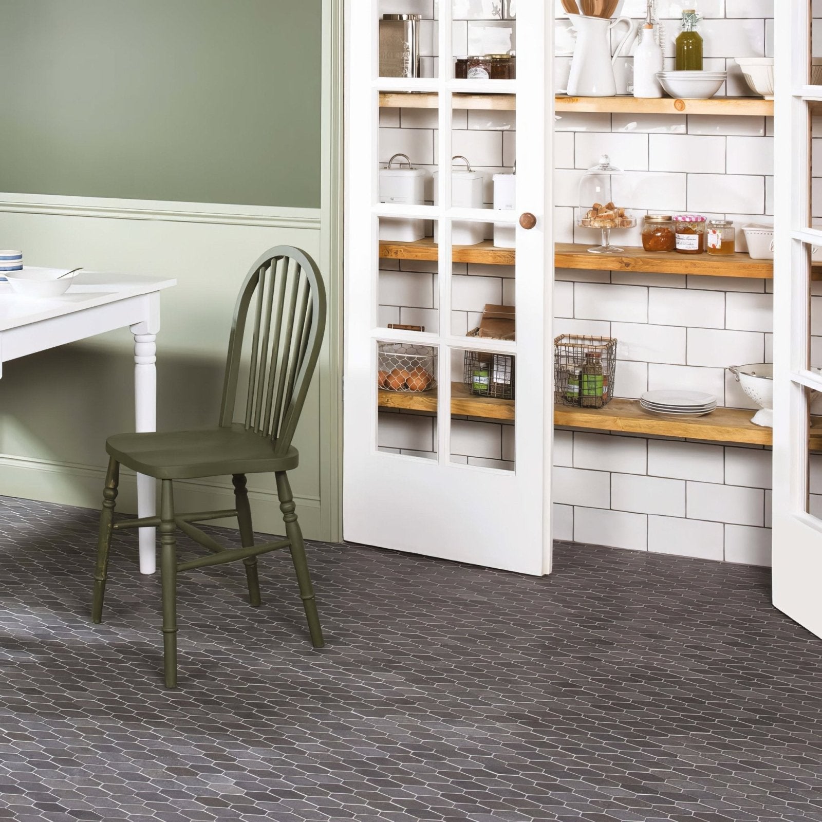 Crypto Large Hexagon Honed Marble Mosaic dark grey marble hexagon mosaic with an olive green spindle-back chair