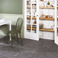 Crypto Large Hexagon Honed Marble Mosaic dark grey marble hexagon mosaic with an olive green spindle-back chair