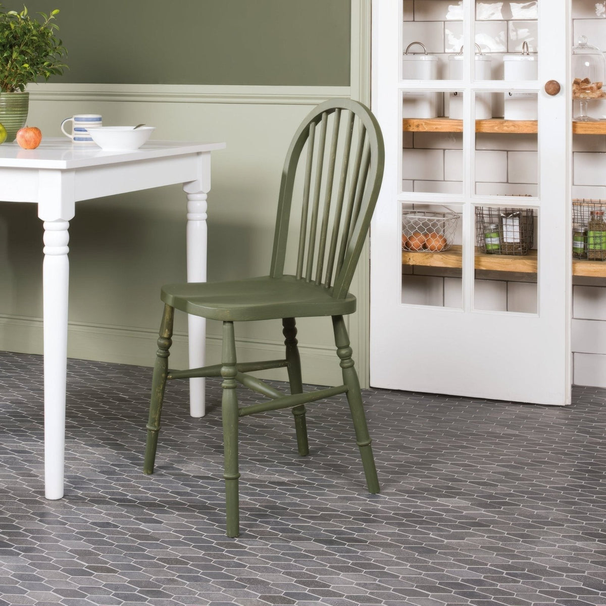 Crypto Large Hexagon Honed Marble Mosaic dark grey marble hexagon mosaic with an olive green wooden chair