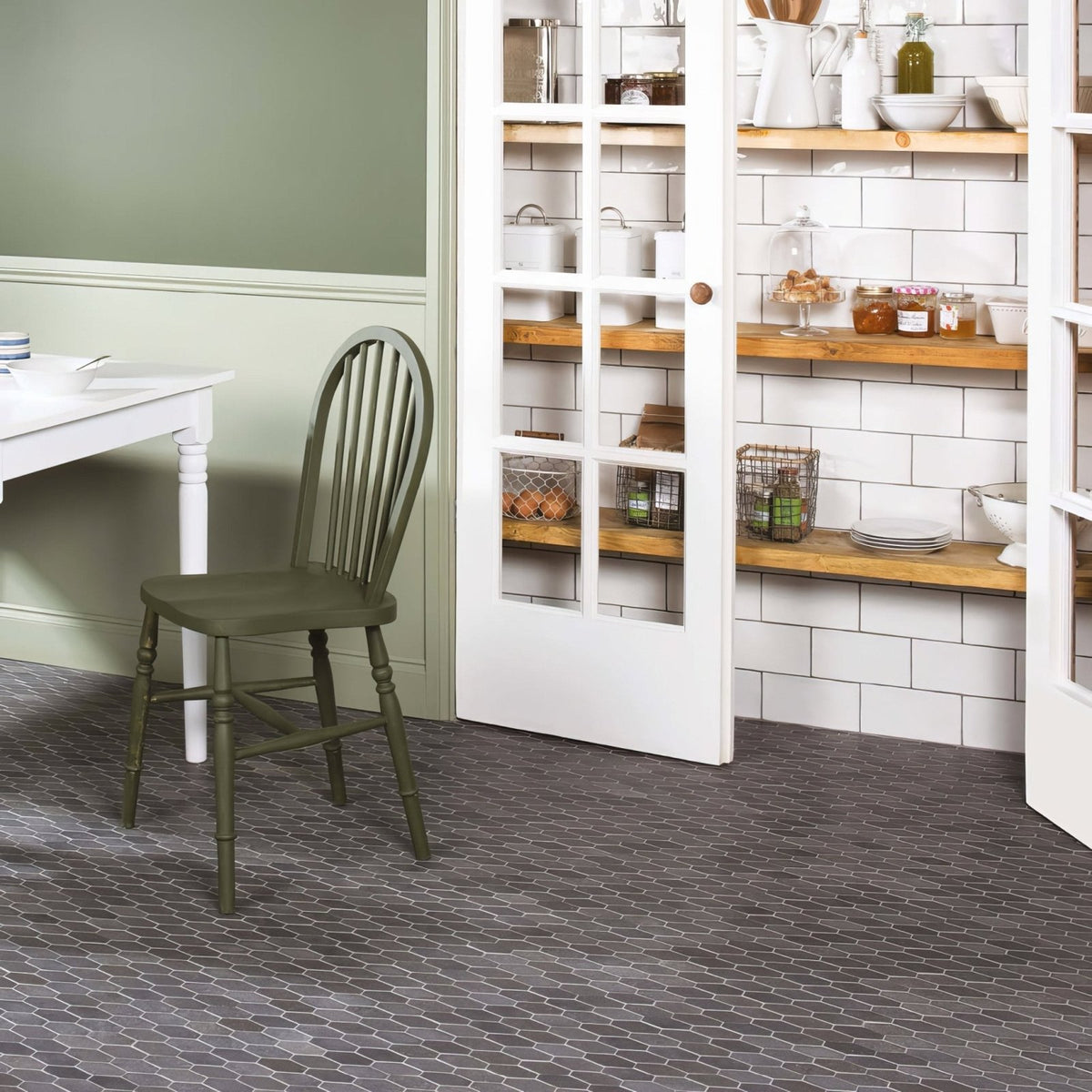 Crypto Large Hexagon Honed Marble Mosaic dark grey marble hexagon mosaic with an olive green slatted chair