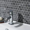 Crypto Small Hexagon Honed Marble Mosaic dark grey marble hexagon mosaic behind a chrome bathroom tap