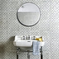 Round mirror with a black frame and textured glass surface from Cuba Porcelain Como collection