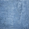 Blue textured stone tile with a mottled weathered surface from cuba porcelain indigo field collection