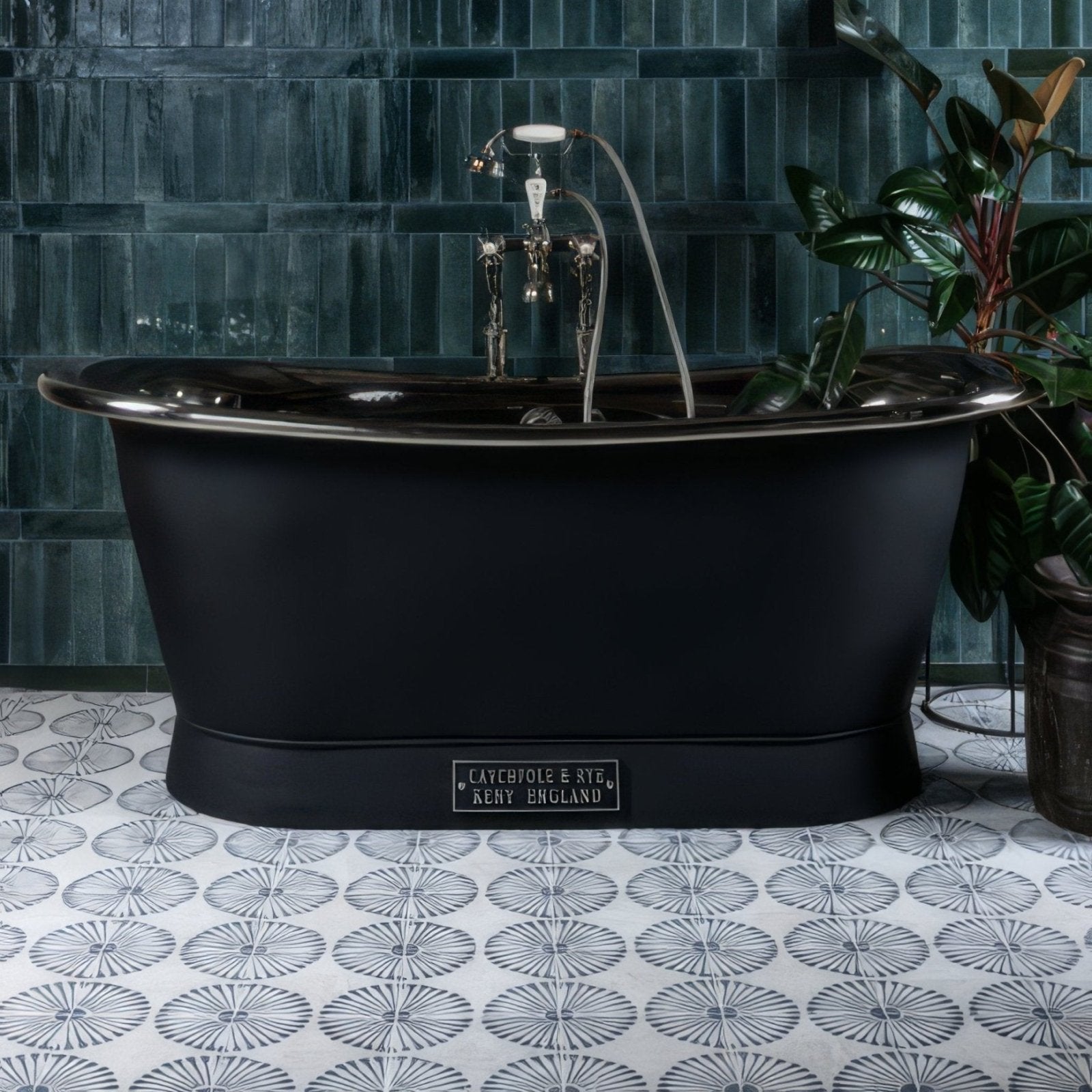 Black matte freestanding porcelain bathtub with polished chrome fixtures and cayebole style plaque from Cuba Infantas Blue