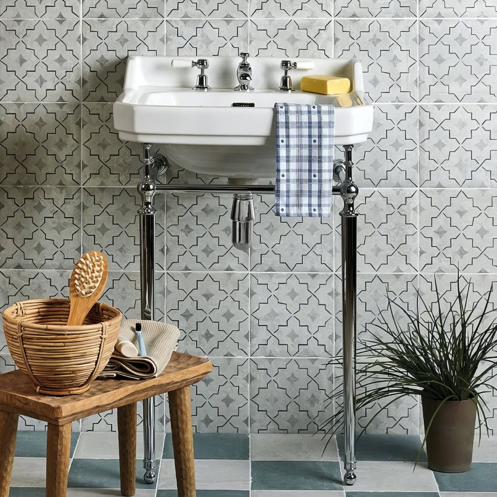 White ceramic pedestal sink with chrome legs and fixtures in cuba porcelain pearl grey field finish