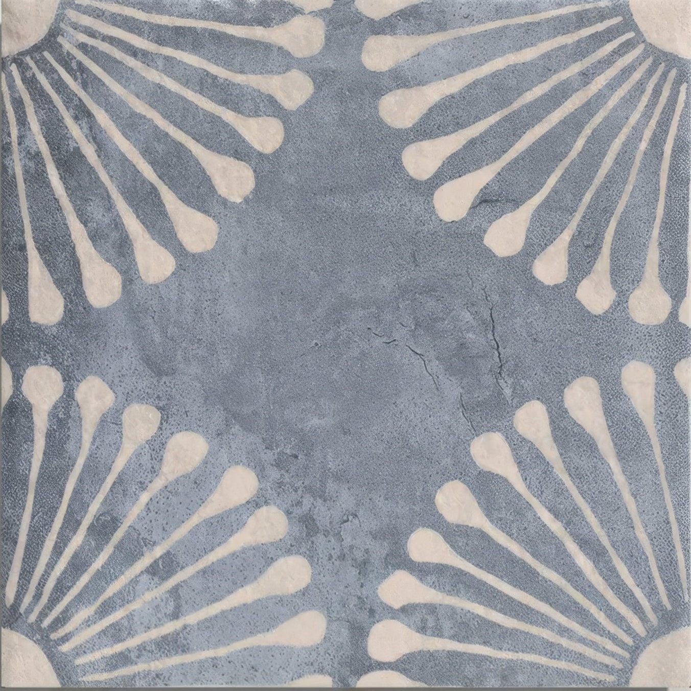 Blue-gray cuba porcelain vedado indigo ceramic tile with textured cracked surface and cream floral radiating patterns