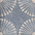 Blue-gray cuba porcelain vedado indigo ceramic tile with textured cracked surface and cream floral radiating patterns