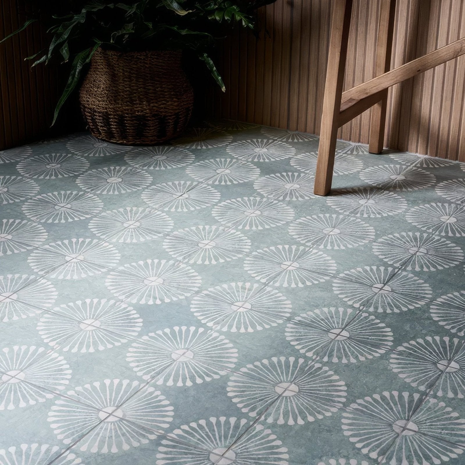 Light blue cuba porcelain vedado mint green floor tiles with repeating white stylized dandelion seed head pattern