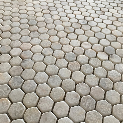 Full Calacatta Sugar hexagon mosaic sheet showing gold and grey veins arriving in fragments across the pieces