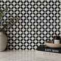 Full mesh-backed sheet of polished Carrara White and Nero Marquina marble flower mosaic