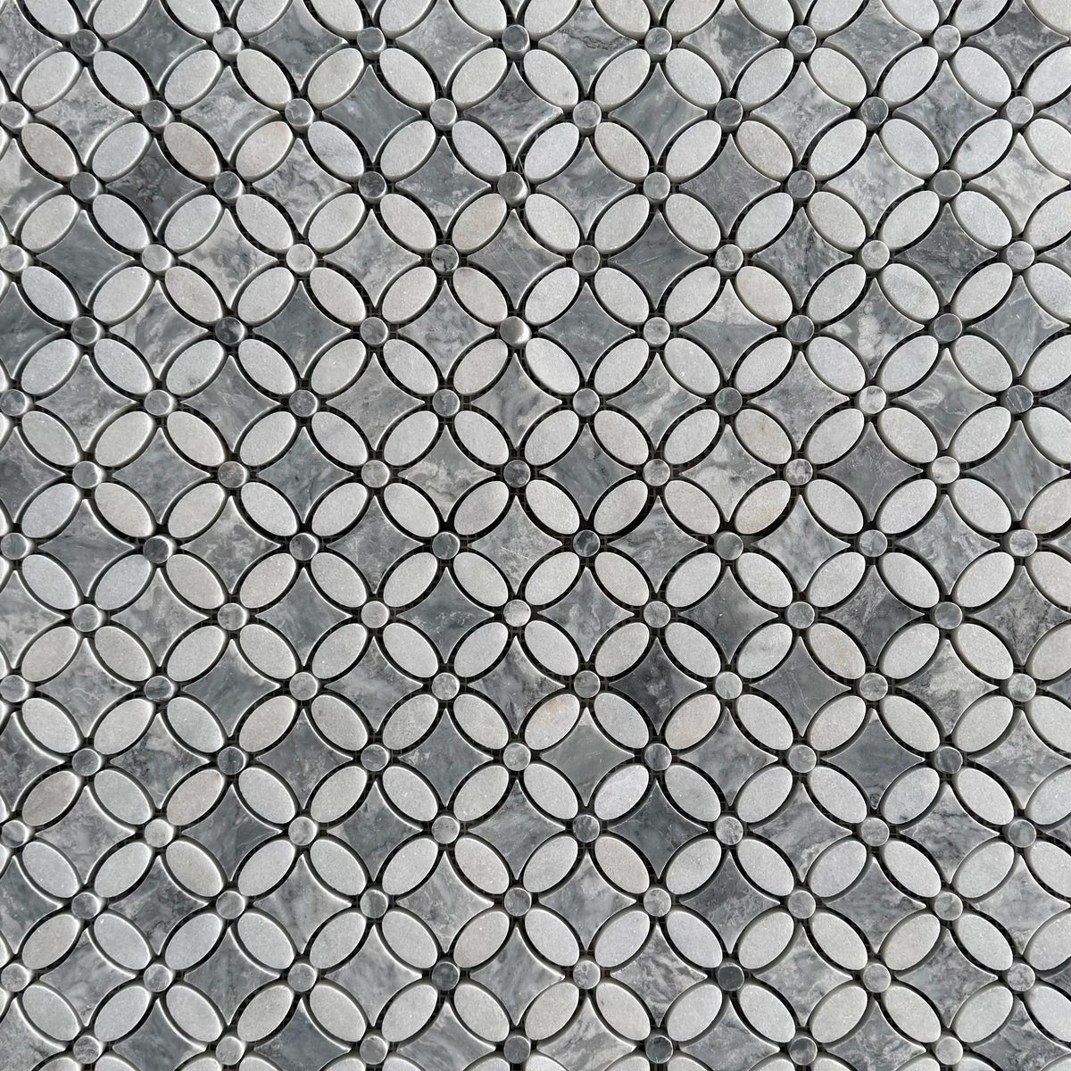 Close detail of the grey marble centre and white Carrara petals in the polished flower mosaic