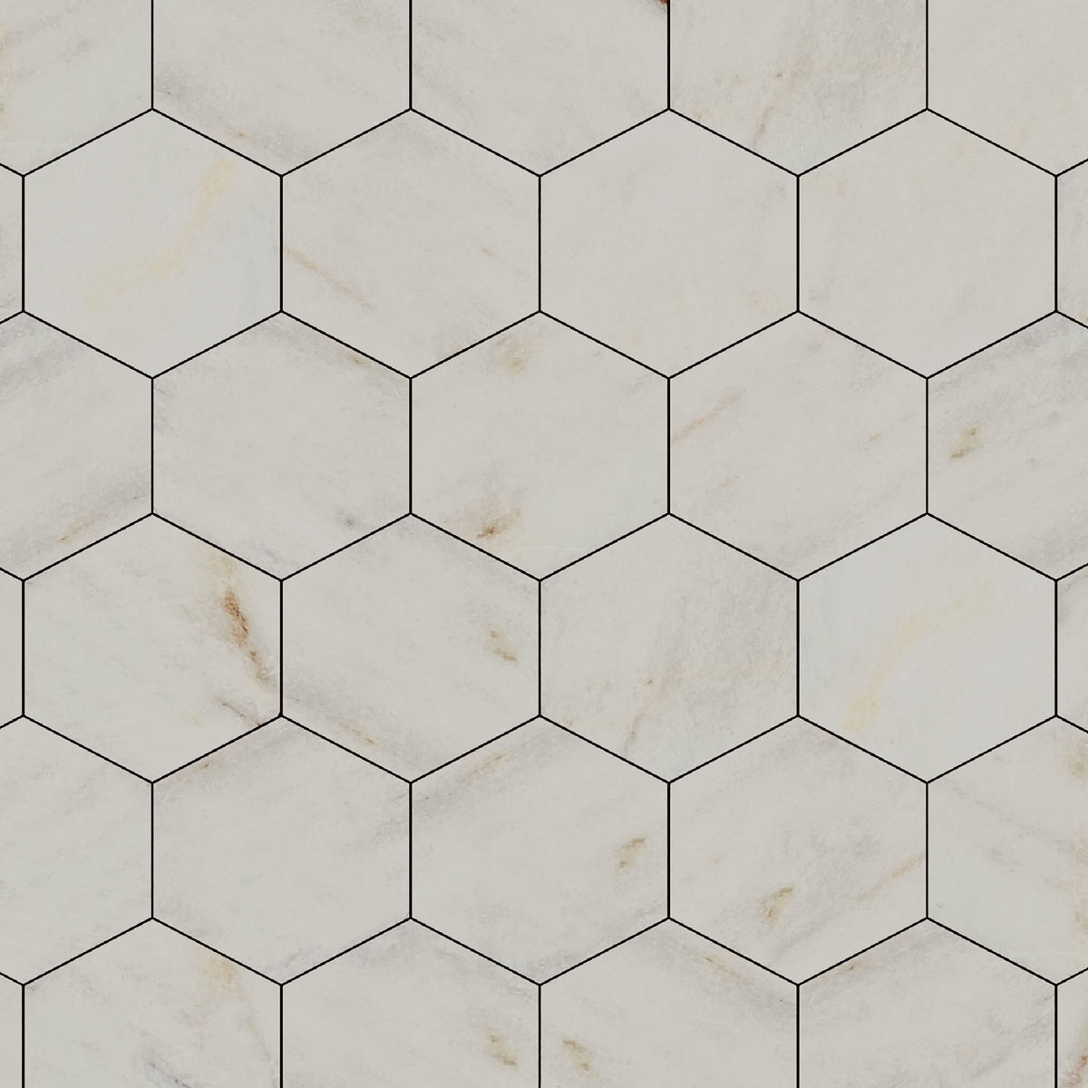 Honed Calacatta marble hexagons laid as a honeycomb bathroom floor