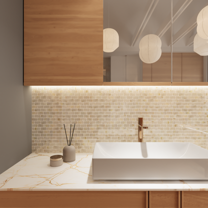Close detail of the polished white and gold Calacatta marble bricks in staggered bond