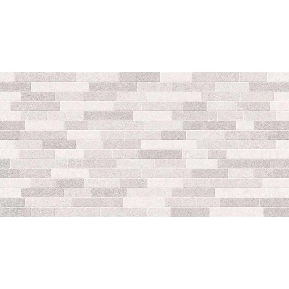 A modern minimalist tile wall with dafne tierra gris decor matt 25 x 50cm alternating light gray and off-white tiles