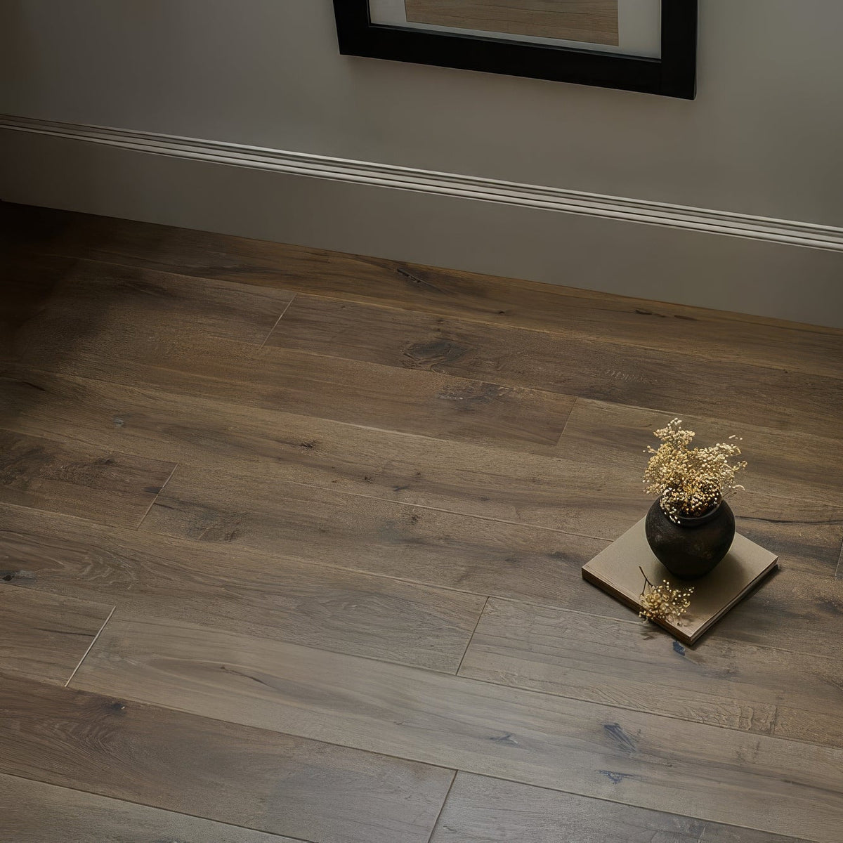Dark gray wood-look laminate flooring with natural grain pattern in dartmouth truffle oak design