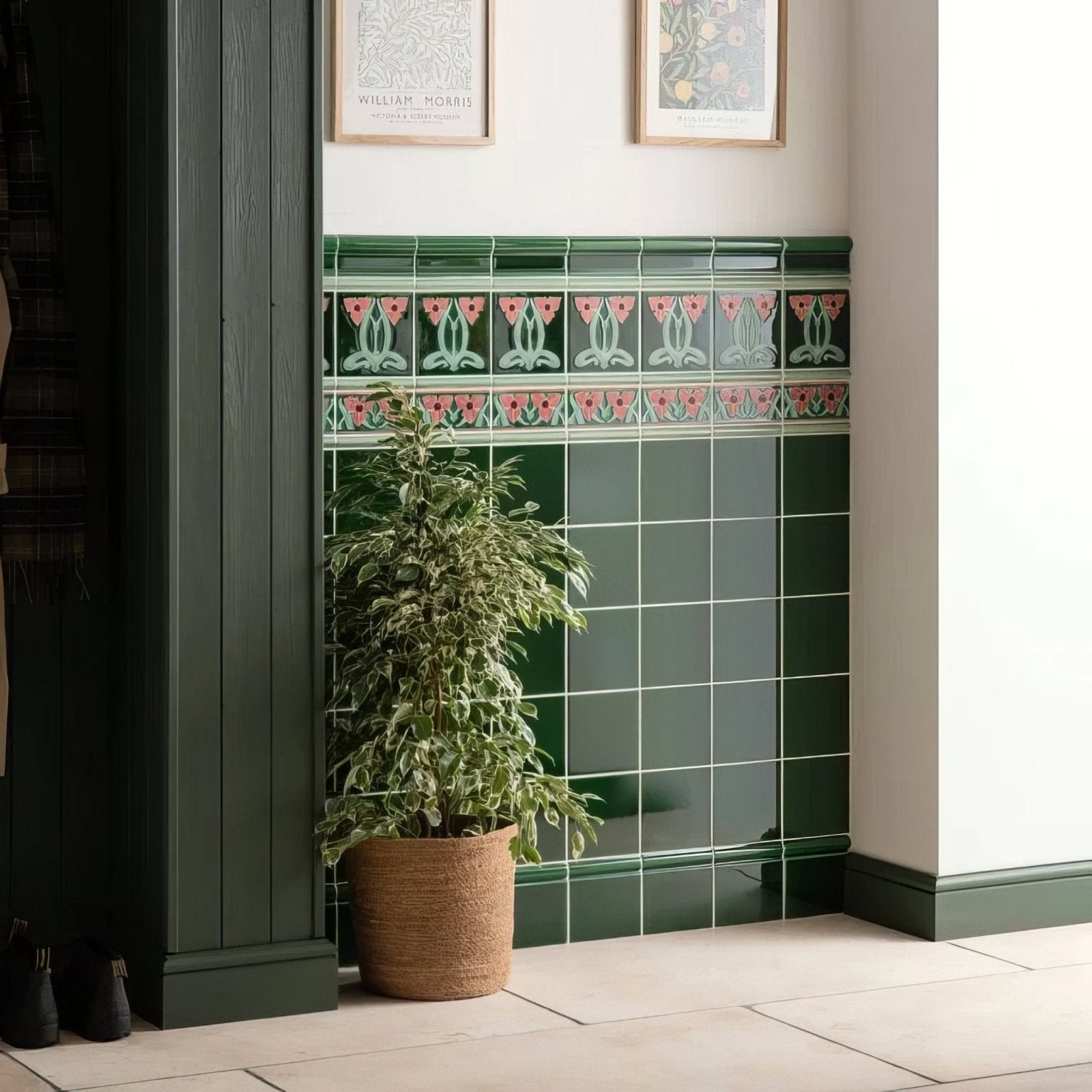Emerald green ceramic tile wall with dauphine border featuring a decorative pink and white floral design