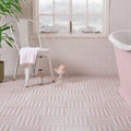 Pink and white striped ceramic floor tiles in a geometric pattern from deck chair porcelain rose collection