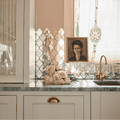 Deco Glass Bell Silver Mosaic silver quatrefoil mirror mosaic with pale pink roses on a marble countertop