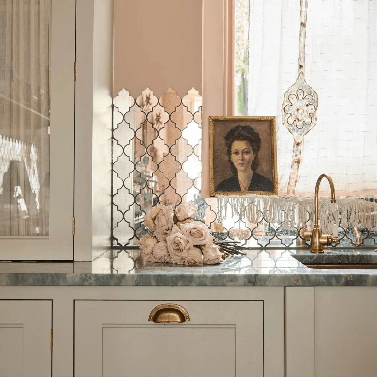 Deco Glass Bell Silver Mosaic silver quatrefoil mirror mosaic with pale pink roses on a marble countertop