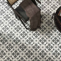 Gray and white patterned 15 x 15cm Decorata 03 tile featuring ornate repeating floral design for decorative flooring