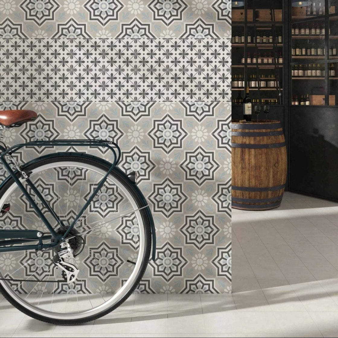 Decorata 10 patterned 15 x 15cm tile with dark green bicycle design featuring brown leather saddle and silver spokes
