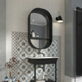 Black oval mirror with integrated shelf above a sink paired with white 15 x 15cm decorata bianco tile