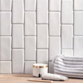 Delft white half tile featuring white rectangular subway tiles with a subtle glossy finish in a brick pattern