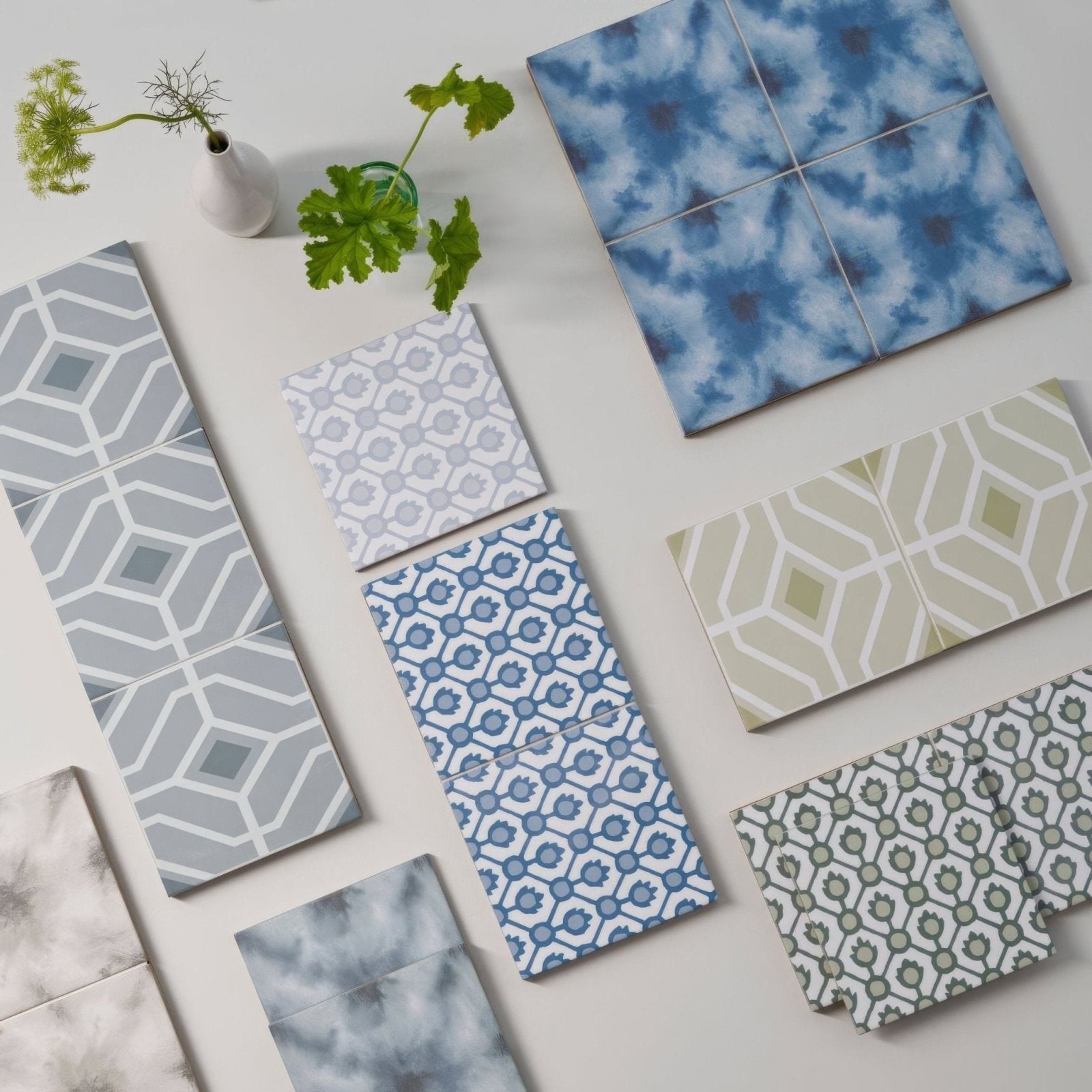 Designers guild jaal cobalt blue and white geometric patterned ceramic tiles in a modern minimalist display