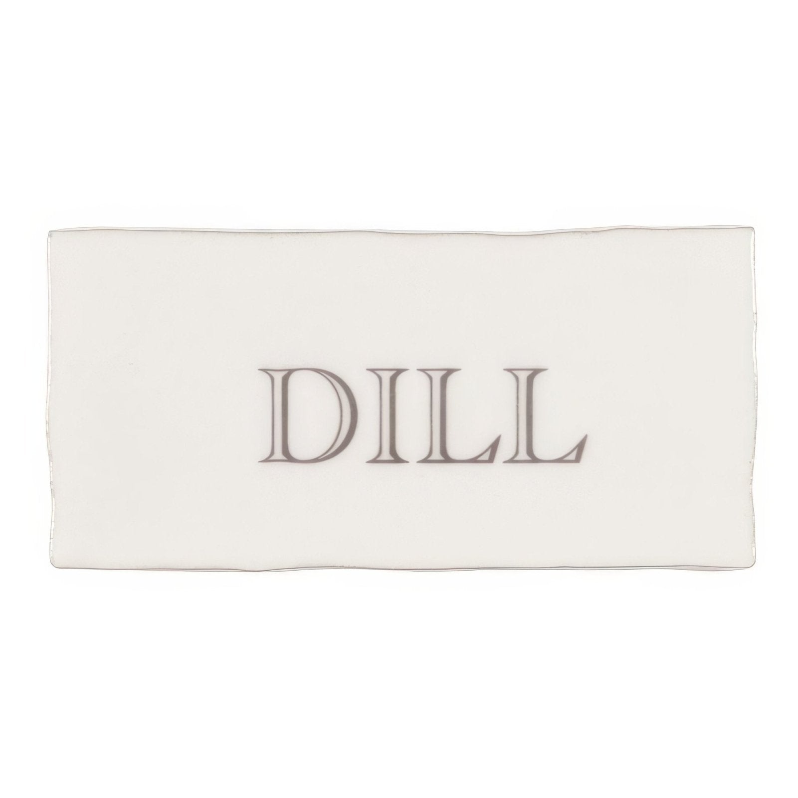 A rectangular white ceramic soap bar named dill in grey on cotton with dill embossed in subtle gray serif font