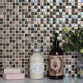 Divine Earth and Fire Mixed Mosaic iridescent brown and beige mosaic with an amber glass hand soap bottle