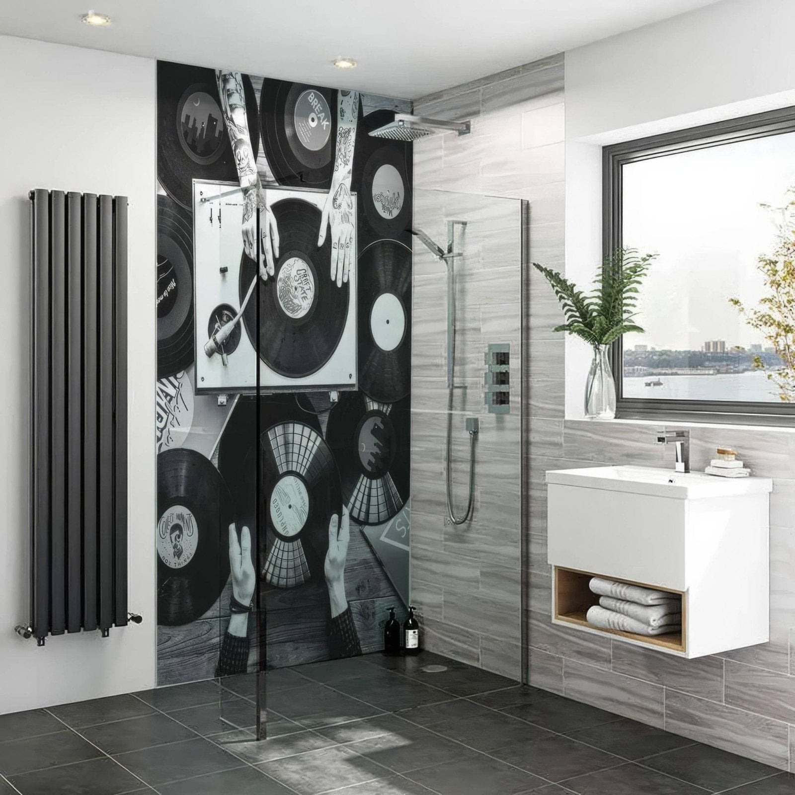 Dj records shower panel featuring a black and white vinyl record themed mural with graphic hands and turntables