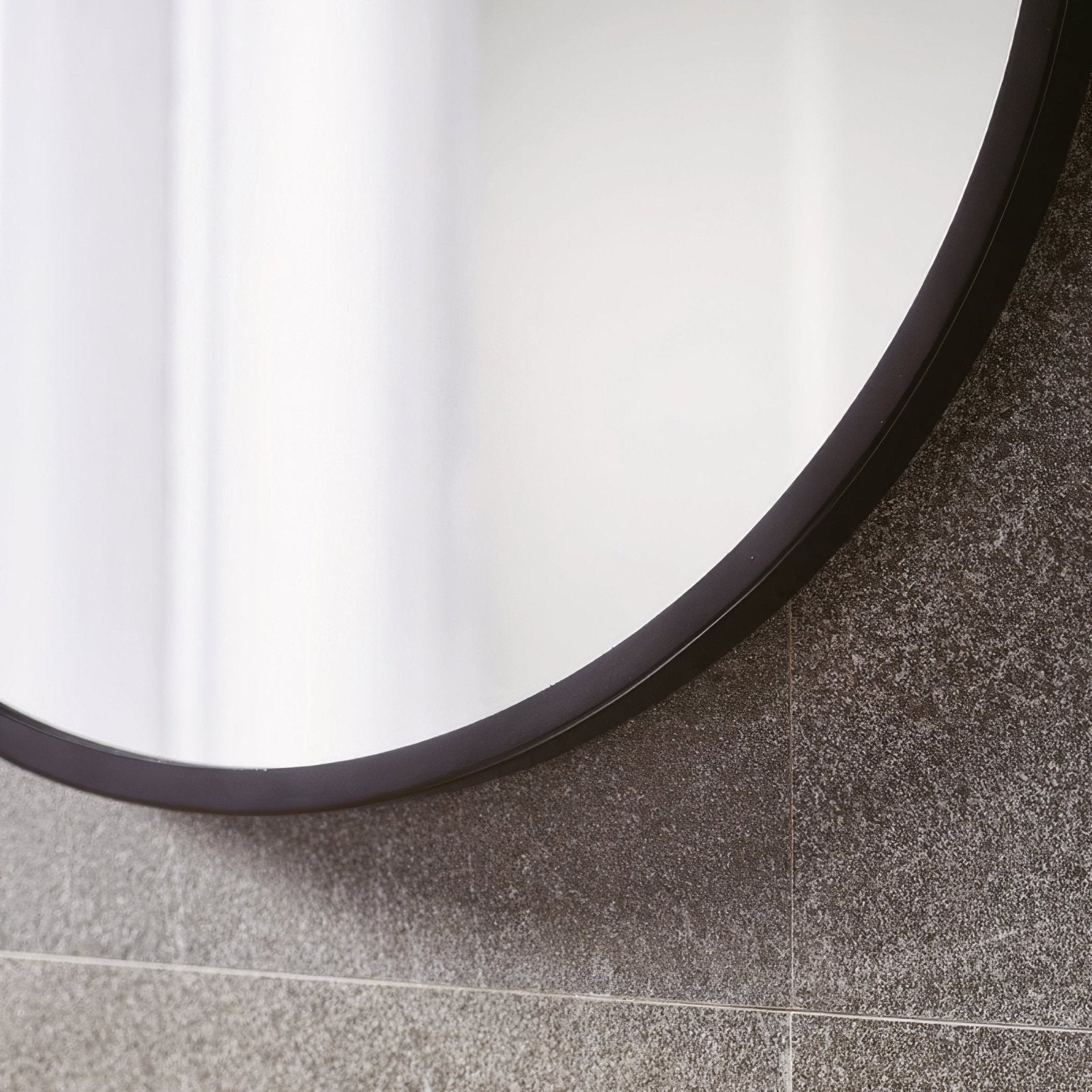 Docklands round mirror 80cm black with sleek black frame mounted on gray tiled wall for modern decor