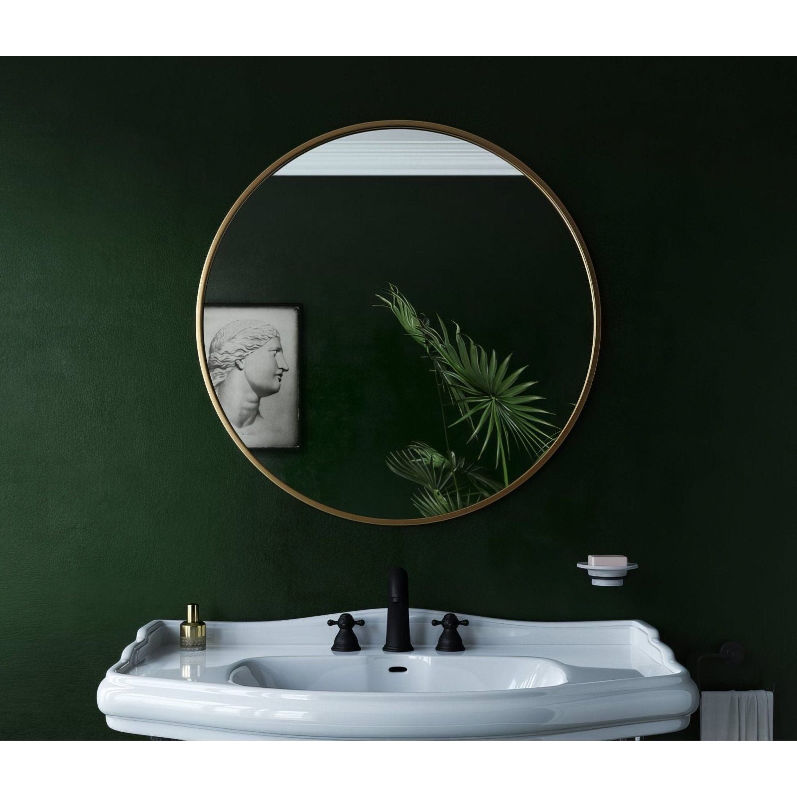 Docklands round mirror 80cm with a thin brushed brass frame mounted above a white ceramic sink
