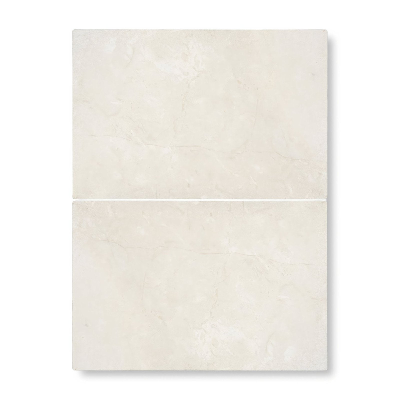Two cream-colored dorzano tumbled edge and surface tiles with subtle marble texture and faint veining 40.6 x 61cm