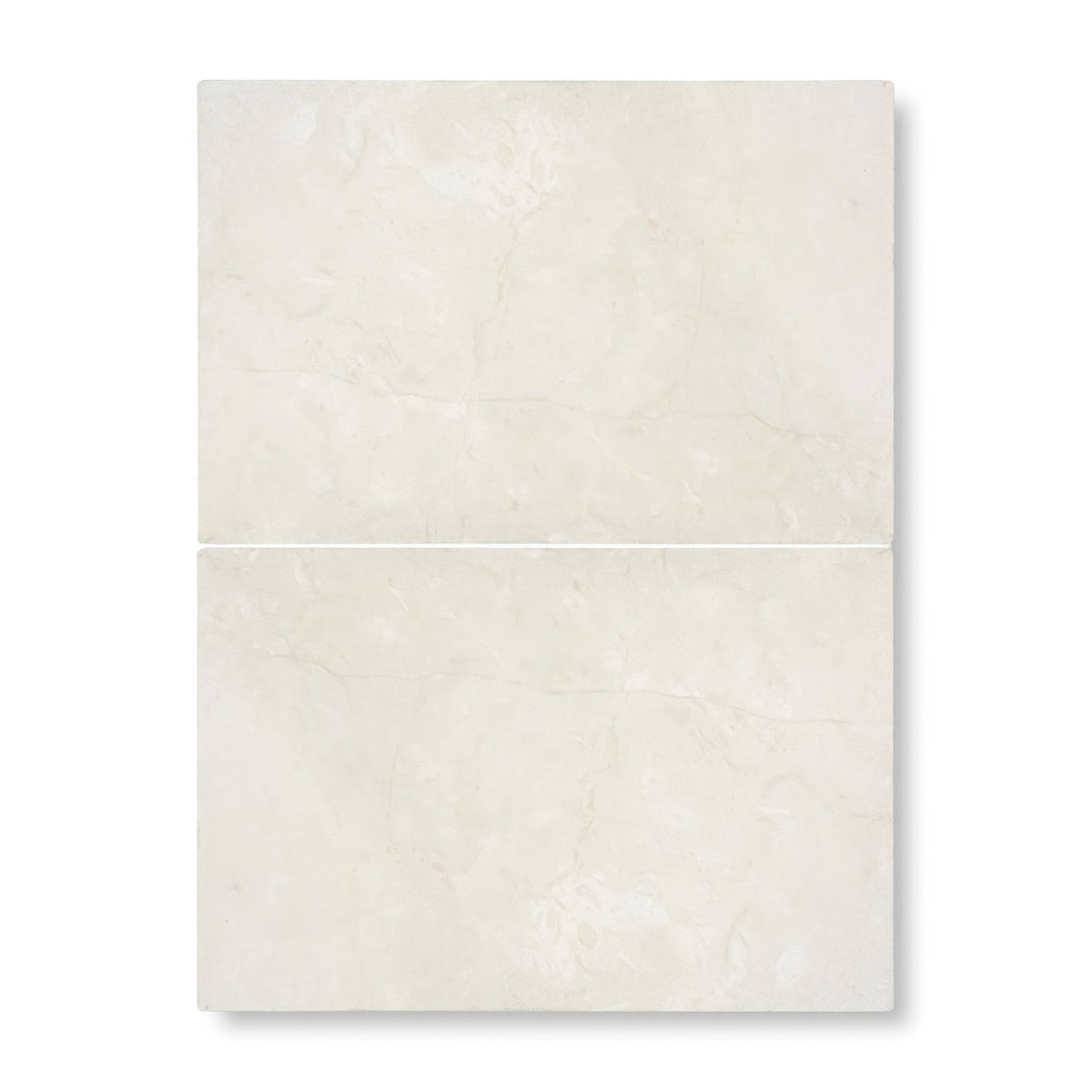 Two cream-colored dorzano tumbled edge and surface tiles with subtle marble texture and faint veining 40.6 x 61cm