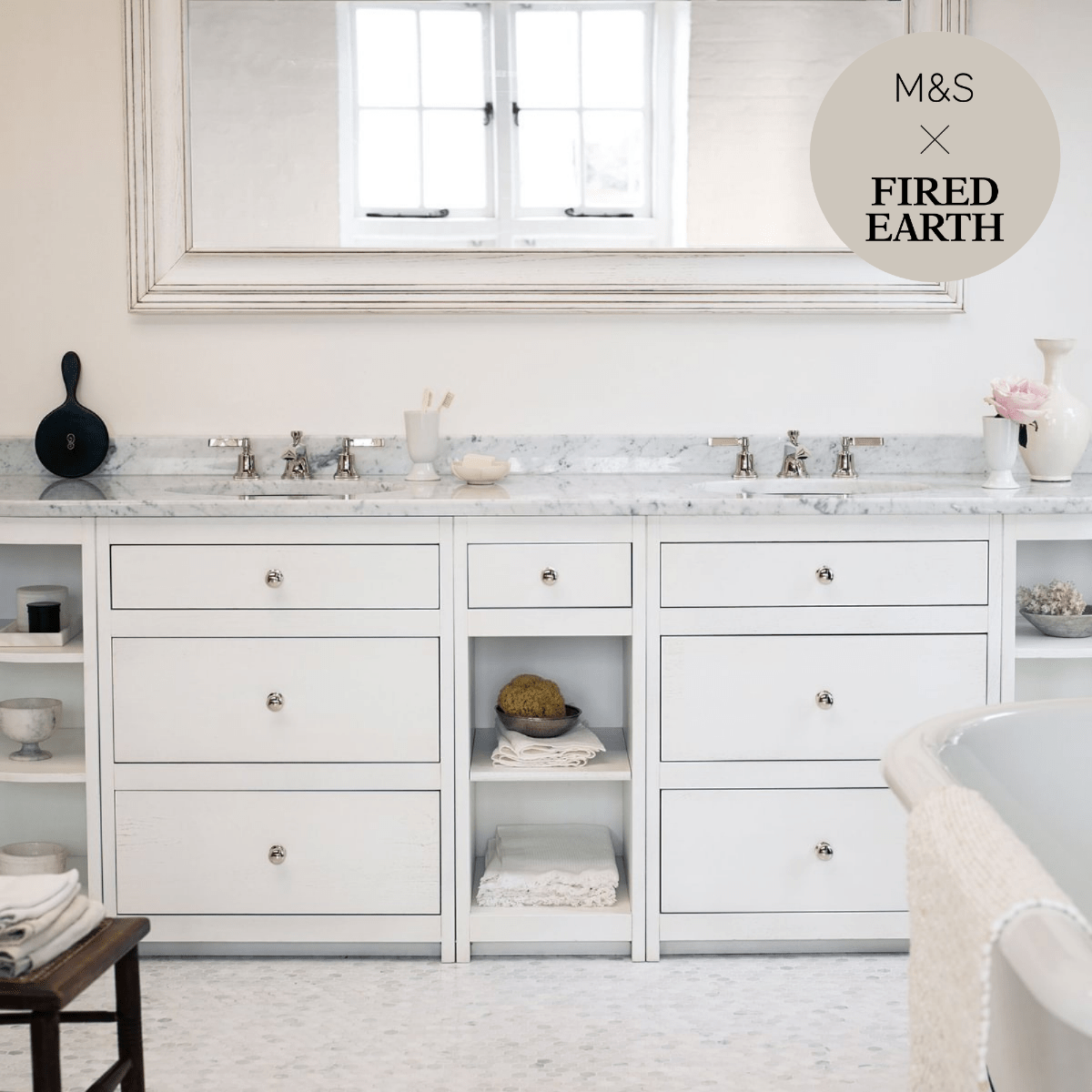 White marble dover cliffs double vanity with silver hardware and open shelving for bathroom storage