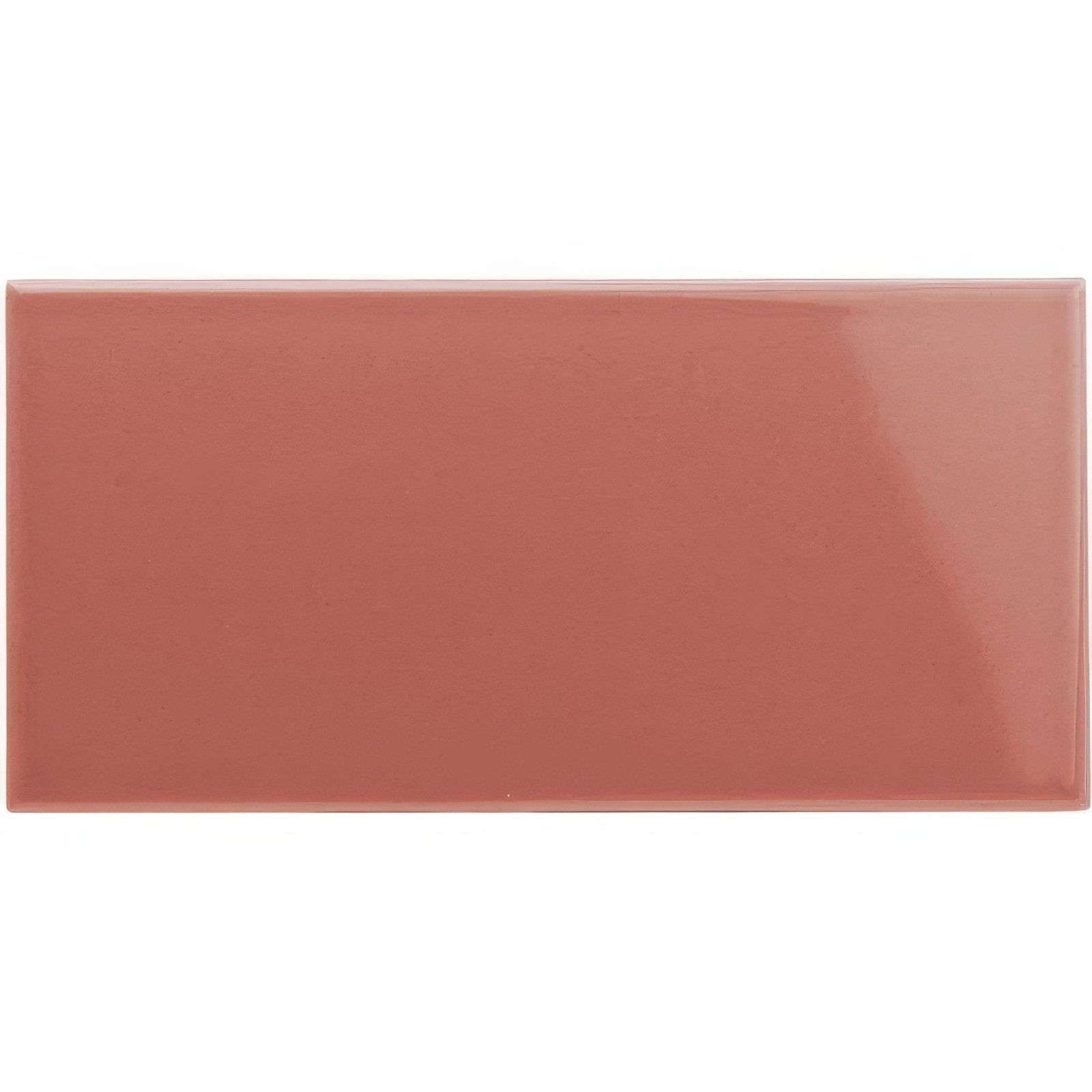 A glossy terracotta colored rectangular ceramic tile duchy pink half tile ideal for wall installations
