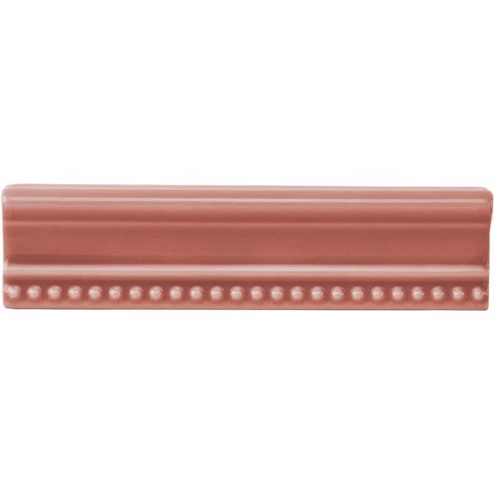 A duchy pink hogarth moulding ceramic tile with a terracotta matte finish beaded edge and horizontal grooves