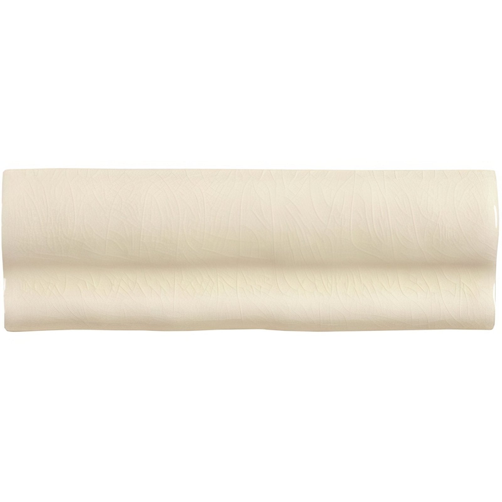 Cream-colored cream ceramic torus moulding dune tile with smooth glossy finish and subtle wavy ridges along length