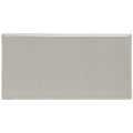 A sleek rectangular dunwich half tile made of ceramic with a smooth matte gray finish and rounded edges