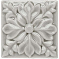 Dunwich Hampstead off-white ceramic tile with raised symmetrical floral petals and leaf design