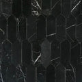 Close detail of white calcite veining across the honed Nero Marquina marble pickets