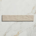 Beige earthenware porcelain linen tile with textured stone-like surface and subtle natural veining