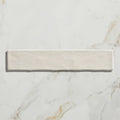 Cream-colored rectangular earthenware porcelain tile with a subtle matte finish and soft natural texture