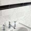 East Hampton Black Marble Dado black and white marble dado tiles with a sink and chrome tap
