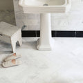 East Hampton Black Marble Skirting black marble skirting with a white pedestal sink