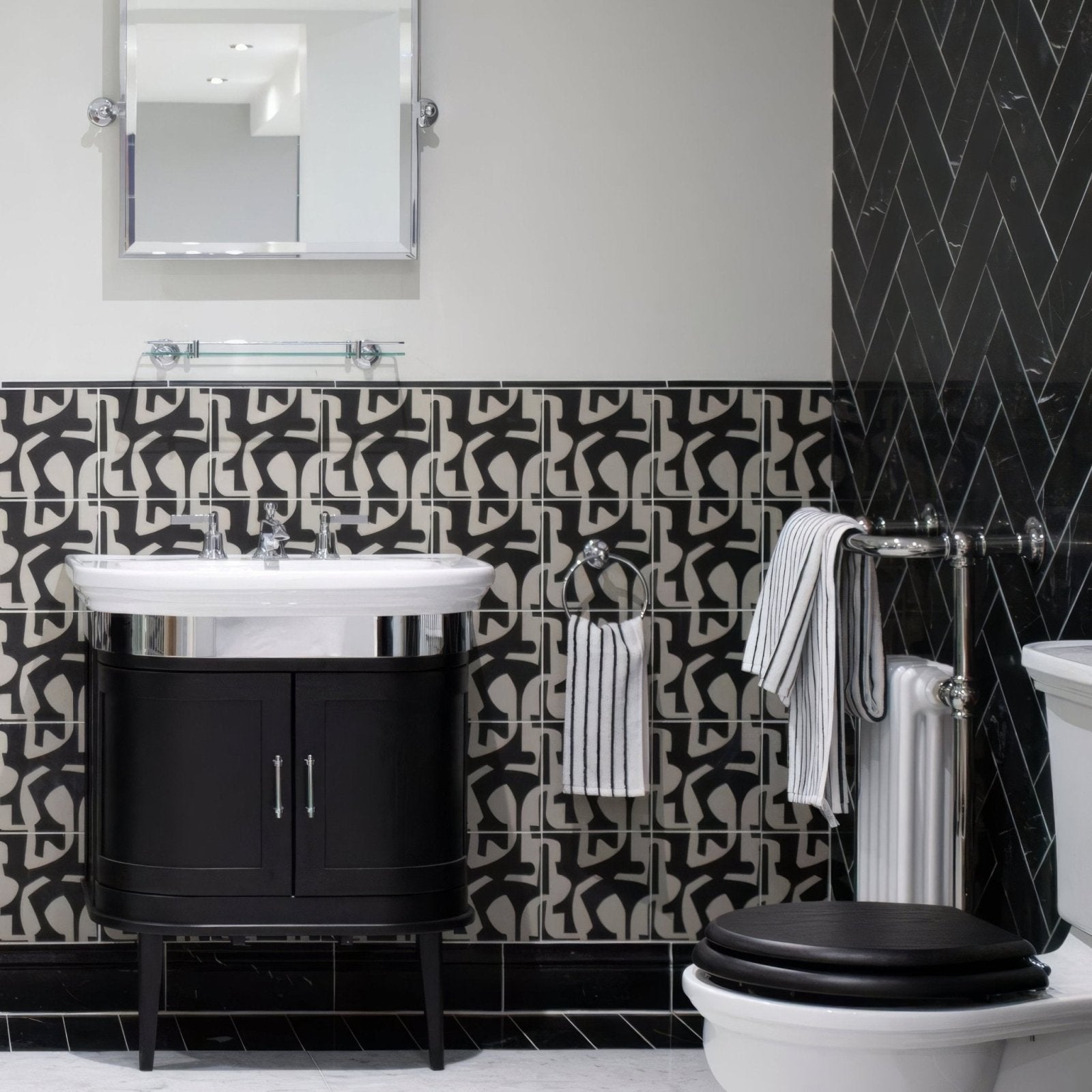 Black and white patterned east hampton black marble tile 10x30cm bathroom wall with herringbone accent section
